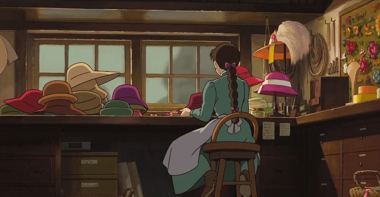 Sophie Hatter making hats in her family's shop while looking out the window, depicting her initial isolation in the anime film Howl's Moving Castle.