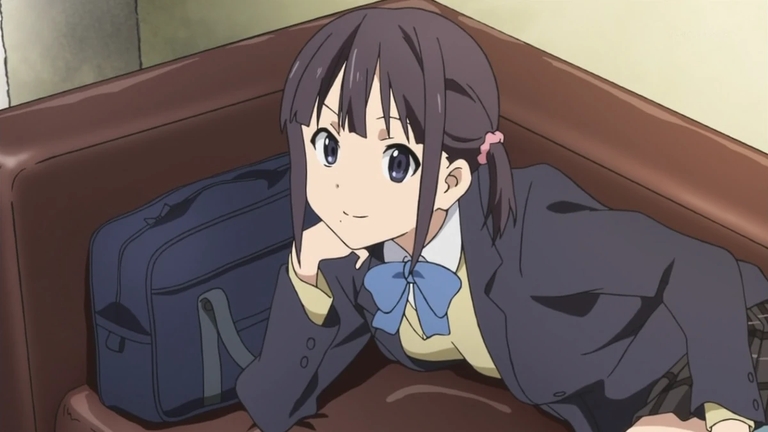 Iori Nagase relaxing on a couch in her school uniform