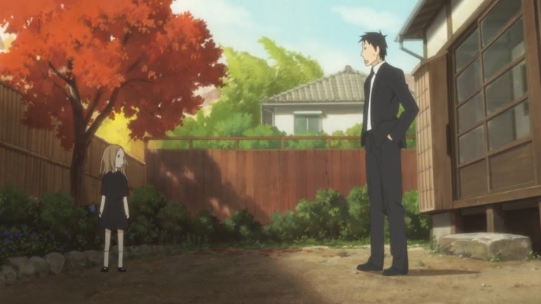 Daikichi Kawachi in a suit observes Rin Kaga in a black dress in a garden setting from the Usagi Drop anime.