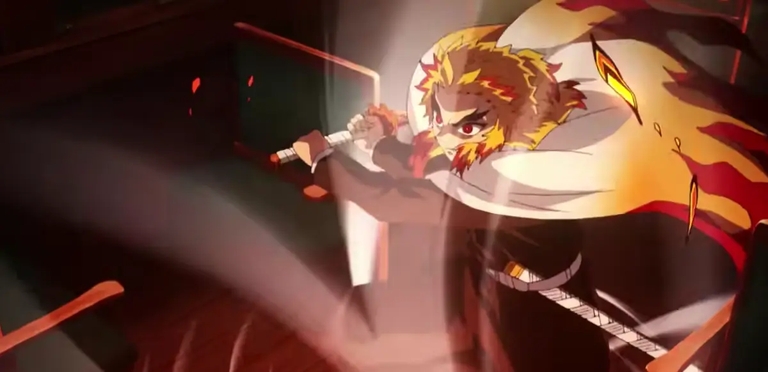 Kyōjurō Rengoku, the Flame Hashira, in an intense combat stance wielding his Nichirin Blade in Demon Slayer: Mugen Train.