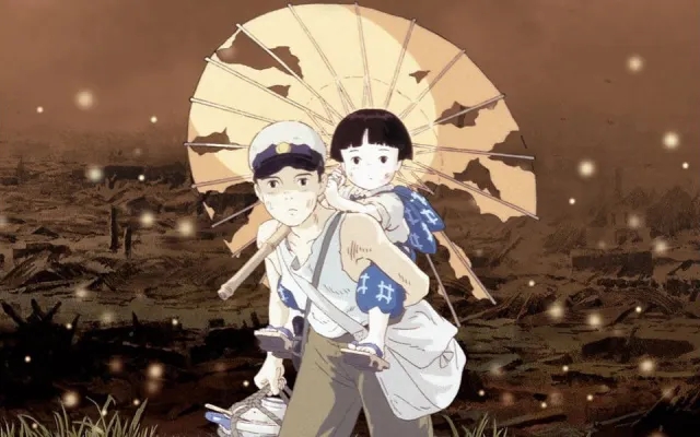 Seita carries his younger sister Setsuko on his back through a destroyed landscape in the Studio Ghibli film Grave of the Fireflies.