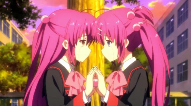 Twin girls with pink hair crying facing each other