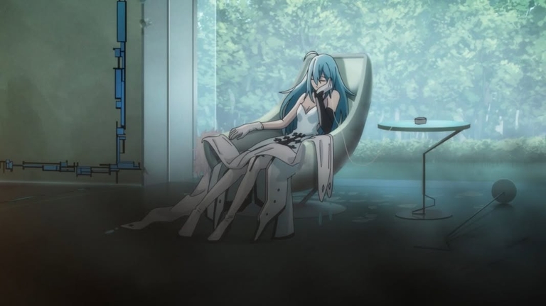 Vivy sitting in a modern chair within a room with large windows